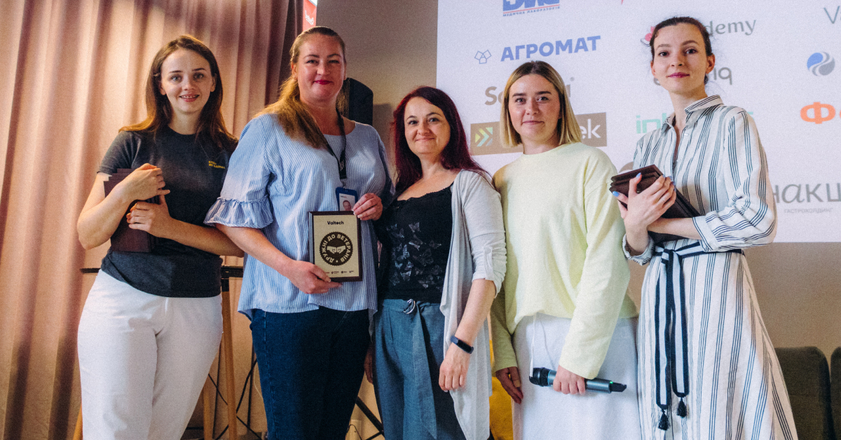 Five females standing next to each other posing with Valtech's earned Veteran Friendly Award from Veteran Hub